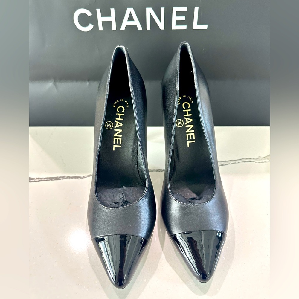 Chanel CC Black Lambskin Leather and Patent leather Cap-Toe Pearl Heel Pumps.